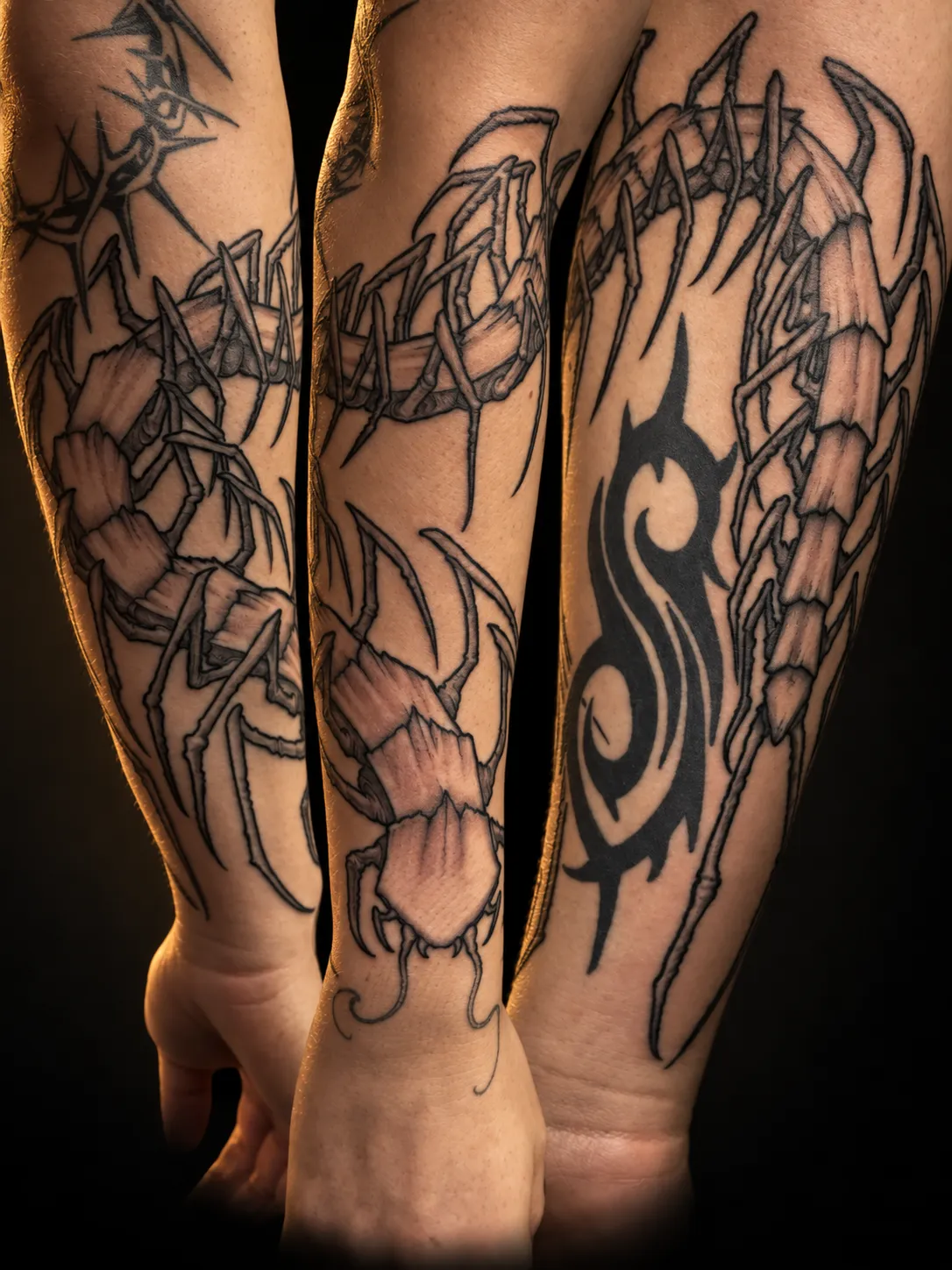 Blackwork centipede tattoo following the body