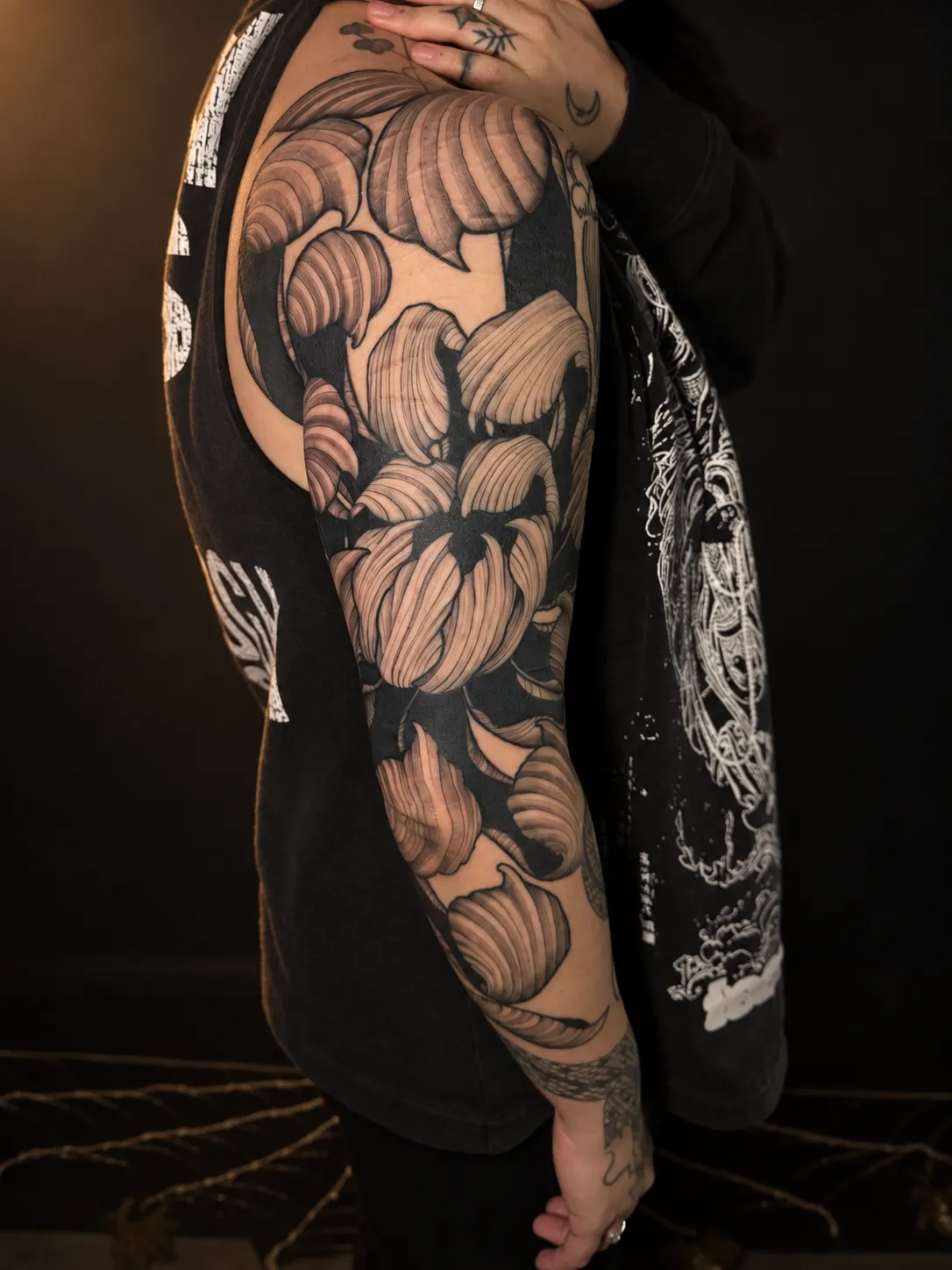 Black and grey chrysanthemum sleeve tattoo