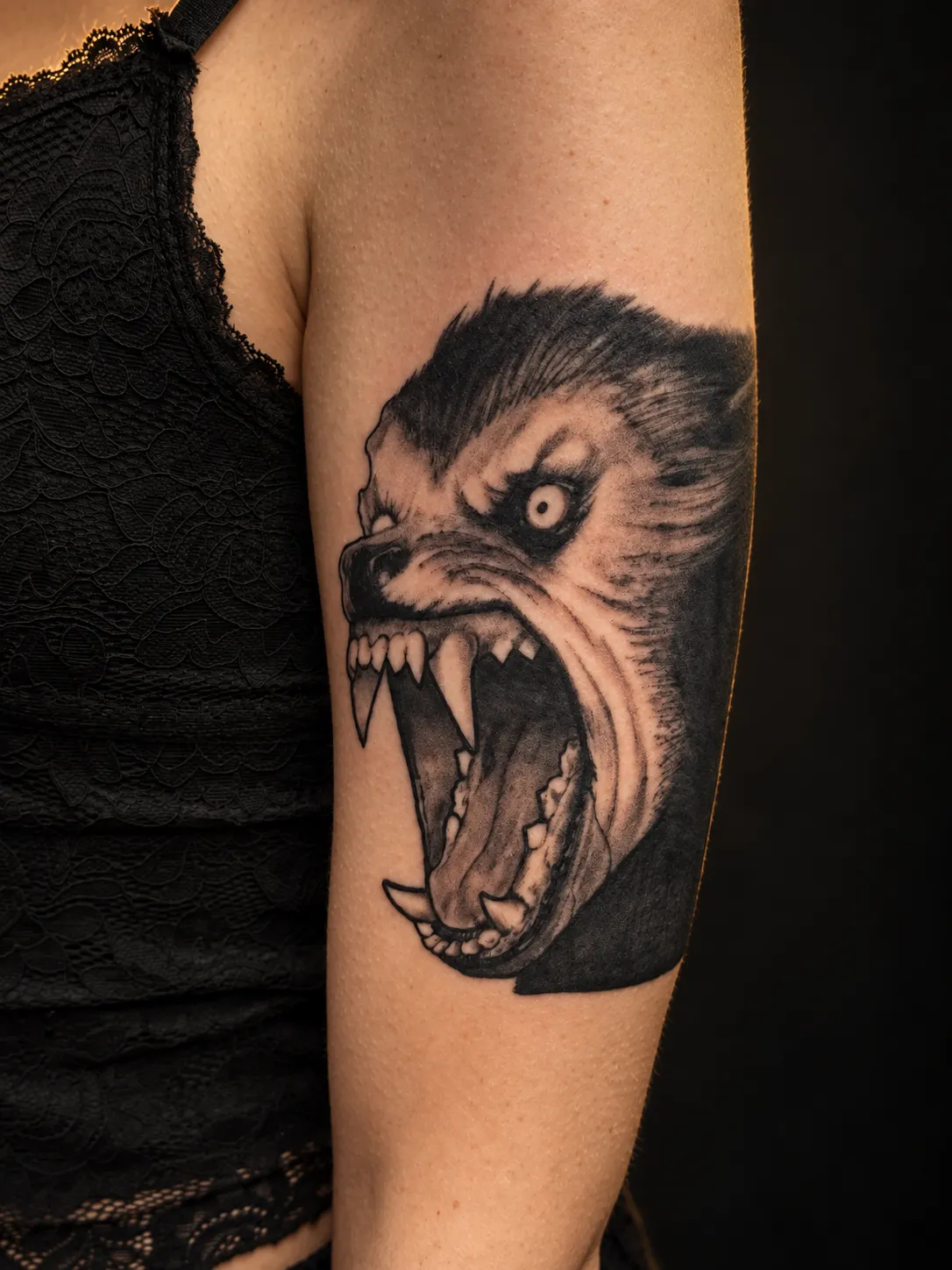 Detailed werewolf tattoo on the arm